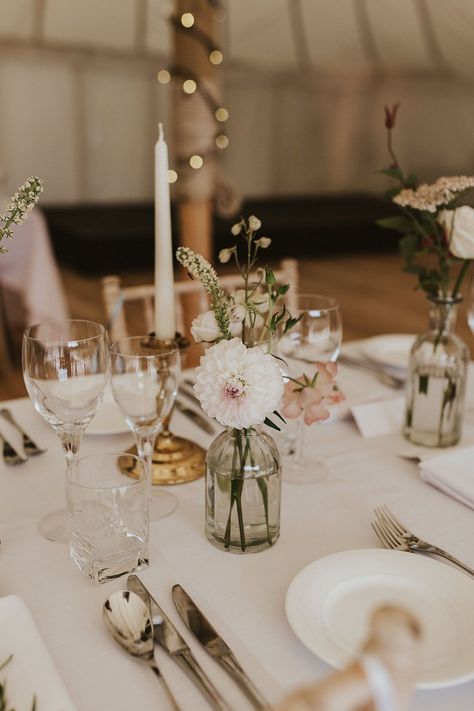 Mini arrangement of pink and white flowers decorating the tables with white taper candles and touches of gold Bud Vases At Wedding, Flowers Laid On Table Wedding, Dainty Wedding Flowers Table, Candle And Flower Centerpieces Wedding, Head Table Bud Vases And Candles, Bud Vase Wedding Table, Bud Vases And Candles Centerpiece, Bud Vases Round Table Wedding, Mini Vases With White Flowers