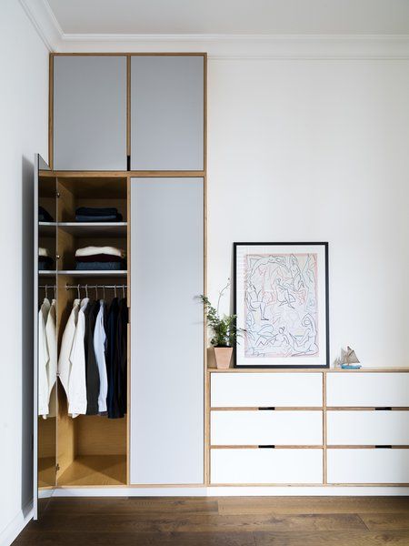 Dwell - A Sleek Renovation in London Ushers Light Into a Family Home Millwork Closet, Scandinavian Closet, Small Closet Storage, Wood And White, Road House, Open Closet, Dressing Rooms, Bedroom Wardrobe, Closet Space