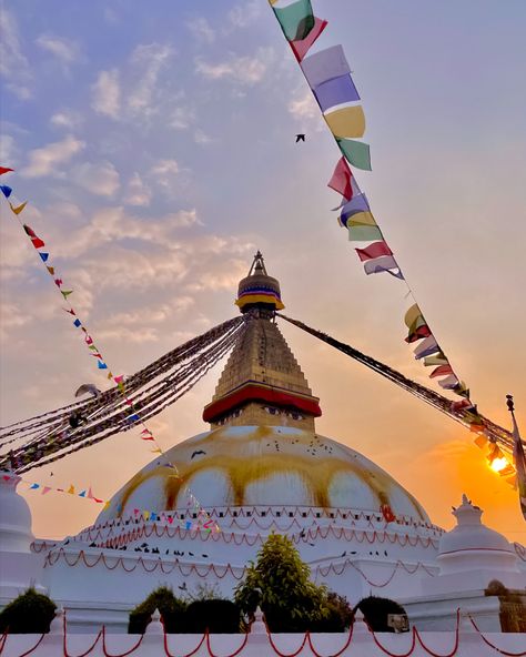 Boudhanath Stupa, a magnificent Buddhist monument in Kathmandu, Nepal. It is one of the largest and ancient stupas in the world and holds great cultural and religious significance. The stupa is adorned with colorful prayer flags and surrounded by shops, monasteries, and cafes. - a must visit attraction in Kathmandu! Boudhanath Stupa, Kathmandu Nepal, Prayer Flags, Heritage Site, World Heritage, Nepal, Monument