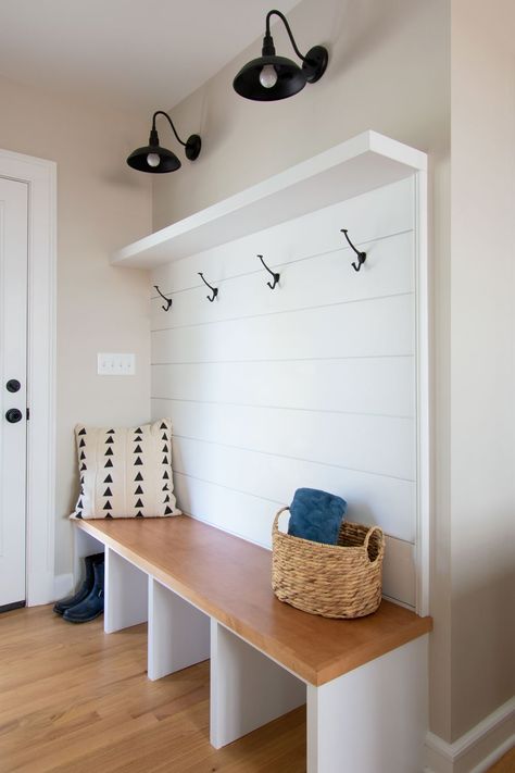 Shiplap provides every homeowner with a stylish modern farmhouse look for their home remodel. The newly-popularized yet old-timey wooden board adds homey, rustic charm to your interior design. Learn how to use shiplap on walls, ceiling and shelves in your kitchen, bathroom and more. #shiplap   #modernfarmhouse #farmhousechic #fixerupper #mudroom #bootbench Shiplap Bench Wall, Shiplap Mudroom, White And Wood Kitchen, Boot Bench, Mudroom Entry, Wood Hood, Shiplap Kitchen, Painting Shiplap, Home Restoration