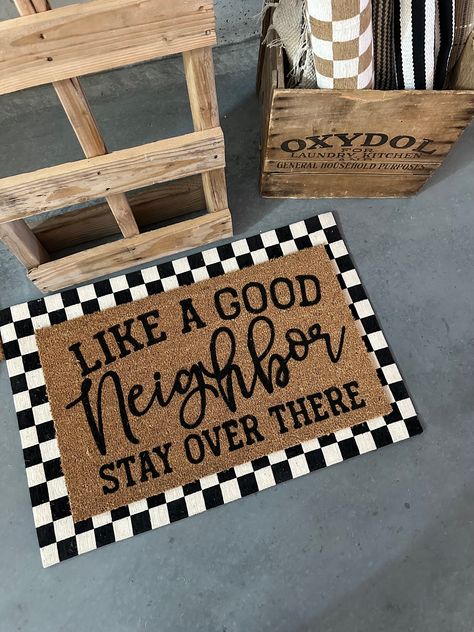 Introducing our "Like A Good Neighbor, Stay Over There" doormat - a humorous and socially distant greeting for your home. Crafted from high-quality materials, this doormat not only adds a touch of wit to your entrance but also sets the tone for respectful space. Keep it lighthearted while maintaining boundaries. Welcome guests with a smile and a subtle reminder to maintain a little distance. Diy Outdoor Mat, Maintaining Boundaries, Fromt Doors, Diy Doormat, Funny Door Mat, Sell Ideas, Doormat Funny, House Organisation, Funny Home Decor