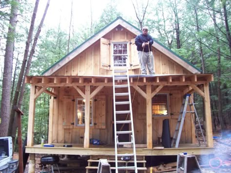 Diary of a 20x24 cabin going up in NH - great pictures for ideas.  LOVE the usable shutters and the way the porch was made 20x24 Cabin, Small Cabins, Cabin Tiny House, Hunting Cabin, Hunting Camp, Tiny Cabins, Tiny Cottage, Cabin Living, Little Cabin