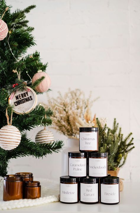 In today's blog post, I'm showcasing Earthside Candle Co's holiday and Christmas product photoshoot! Read on to see our studio setup & props. | Emily Kim Photography | christmas product photography, christmas product photoshoot, christmas product photography styling, christmas product photography ideas, christmas product shoot, candle photography, candle photography ideas, candle photography inspiration Christmas Photoshoot Ideas For Products, Christmas Packaging Photography, Ornament Product Photography, Christmas Candle Photography Ideas, Christmas Candle Shoot, Christmas Candles Photography, Christmas Tree Product Photography, Holiday Shoot Ideas, Christmas Ornaments Photography