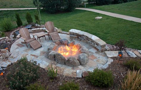 Overhead view of oval flagstone patio with large fire pit created with a series of huge boulders. Flagstone Patio Design, Diy Fire Pit Ideas, Fire Pit Plans, Fire Pit With Rocks, Outdoor Fire Pit Seating, Outside Fire Pits, Fire Pit Ideas, Large Fire Pit, Outdoor Fire Pit Designs