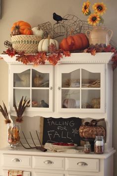 Halloween decorations - simple fall decor for hutch including white & orange pumpkins, fall leave garland, farmhouse style crock and tools. Pitch Fork, Fall Leaf Garland, Hutch Decor, Chalkboard Decor, Cottage Shabby Chic, Fall Kitchen Decor, Fall Thanksgiving Decor, Fall Deco, Autumn Decorating