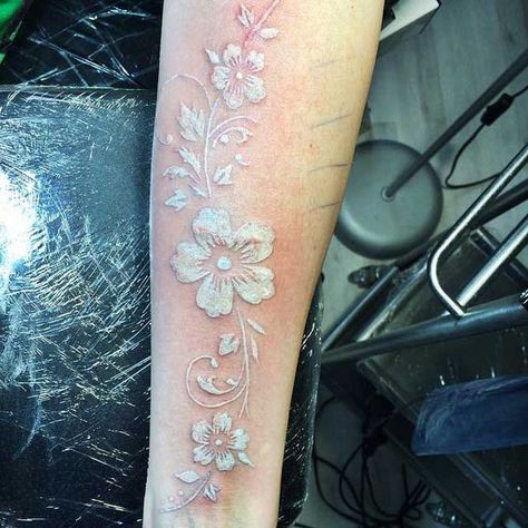 Beautiful white inked flower along the arm by Antaolii Art | www.otziapp.com White Lace Tattoo, White Watercolor Tattoo, White Ink Flower Tattoo, White Floral Tattoo, White Ink Tattoos Healed, White Flower Tattoo, White Flower Tattoos, Black And White Flower Tattoo, Lines Tattoo