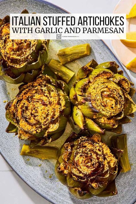 Stuffed artichokes with parmesan cheese, garlic, parsley and crispy breadcrumbs. Make this easy stuffed artichoke recipe for a show-stopping vegetarian main or as a restaurant-worthy side dish. Stuffed Artichokes, Baked Greek Chicken, Spring Salad Recipes, Roasted Artichoke, The Mediterranean Dish, Artichoke Recipes, Spinach Recipes, Mediterranean Dishes, Asparagus Recipe