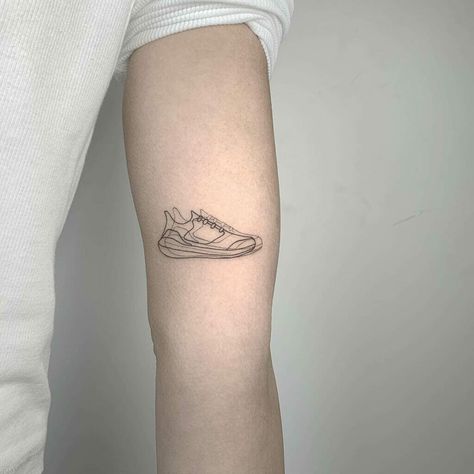 Running Tattoo Run Tattoo For Women, Cross Country Tattoo, Trainer Tattoo, Running Shoe Tattoo, Minimalist Running Tattoo, Track Tattoo Runners, Running Shoe Tattoo Ideas, Small Running Tattoo, Ultra Running Tattoo