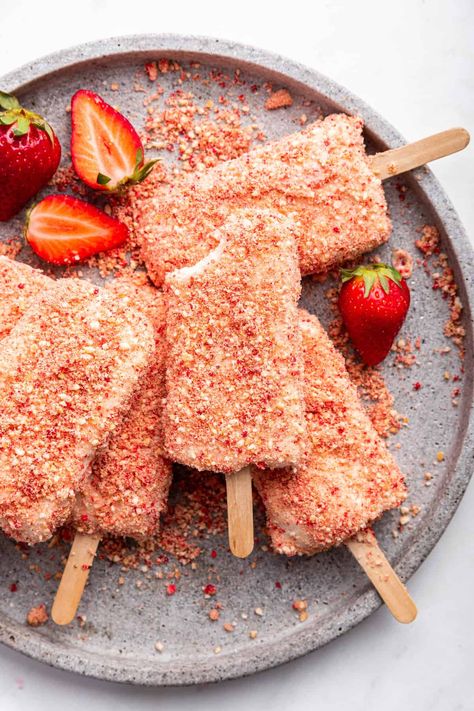 These strawberry shortcake ice cream bars put a homemade spin on a childhood favorite! With a creamy strawberry inside and crunchy shortcake bits on the outside, they’re sure to be a hit. Strawberry Ice Cream Bar, Ice Cream Bar Recipe, Homemade Strawberry Shortcake, Strawberry Shortcake Ice Cream, Frozen Treats Recipes, Ice Cream Mixture, Strawberry Shortcake Recipes, Frozen Dessert Recipe, Freeze Dried Strawberries