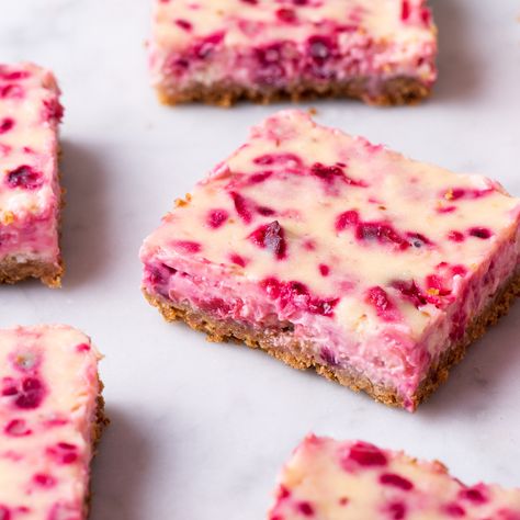 Cranberry-Lemon Cheesecake Bars Lemon Cranberry Cheesecake Bars Delish, Lemon Cranberry Bars, Lemon Cranberry Cheesecake Bars, Lemon Raspberry Bars, Key Lime Pie Cheesecake, Lemon Blueberry Bars, Cranberry Recipe, Easy Menu, Blueberry Cheesecake Bars