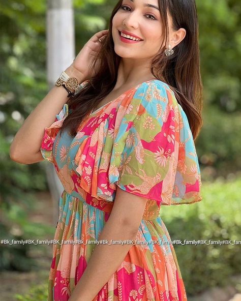 This multicolored dress is crafted from premium Georgette, a lightweight and sheer fabric. It showcases a stunning floral print and is designed with ruffled short sleeves for a playful, stylish touch. The V-neckline offers a sophisticated and flattering look. For convenience, the dress includes a back zipper. It is padded for extra comfort and support, making it perfect for special occasions. (It's come with a back zip and padded) Product Name: Kylie Multi Colour Midi Dress Fabric: Georgette... Georgette Dress Western, Frock Models, Multicolored Dress, Georgette Dress, Indo Western, Western Dresses, Sheer Fabric, Sheer Fabrics, Dress Fabric