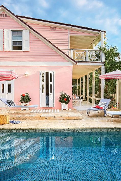 Style blogger Chassity Evans of @looklingerlove re-energizes an old limestone blockhouse on Harbour Island as a playful and pretty retreat for her family—and plenty of friends! We'll be sure to pack our swimsuit.⁠ Pink Beach House, Rustic Nautical Decor, Case Creole, Bloxburg Beach House, House On The Beach, Coral House, Coastal Living Magazine, Beach House Exterior, Beach Haven