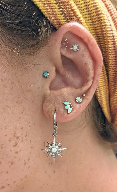 Silver And Opal Ear Piercings, Ear Inspiration Piercing Silver, Opal Curated Ear, Opal Ear Styling, Earrings Stack Aesthetic, Colorful Ear Curation, Ear Styling Ideas Silver, Opal Piercing Ears, Curated Ear Silver