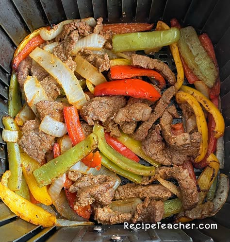 Marinated steak, onion and bell peppers, cooked to perfection in an air fryer to make amazing air fryer steak fajitas. Air Fryer Steak And Peppers, Steak Fajita Air Fryer, Air Fryer Steak Fajitas Recipes, Steak Fajitas In Air Fryer, Steak Fajitas Air Fryer, Beef Fajitas In Air Fryer, Air Fryer Pepper Steak, Air Fryer Beef Fajitas, Air Fryer Fajita Steak