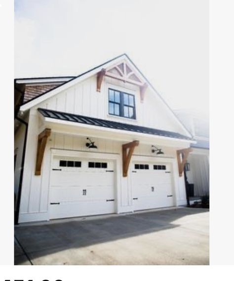 Pergola Over Garage Door Wood, Outdoor Light Above Garage, Decorative Garage Overhang, Awning Above Garage Door, Farmhouse Exterior Lighting Garage, White And Black House Exterior With Wood, Lights Above Garage Door, Garage Awnings Exterior, Decorative Eaves Exterior