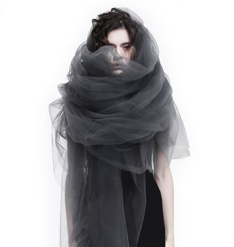 🖤This avant-garde tulle wrap is so lightweight and sheer. Made of soft tulle. Extremely long and wide. This tulle piece can be worn as scarf, cocoon wrap, veil, evening cover up, for wedding photo shoots, parties, ceremonies, maternity photo shoots or very special events. You can wear it in many different ways by wrapping and tying it. #sheershrug #maternityphotoshoot #gothicveil #gothicscarf #steampunkwrap #tullecloak #sheercapeveil #avantgarde #seethrough #futuristic #techwear #tulleshawl Tulle Photoshoot, Black Bridal Veil, Tulle Scarf, Maternity Photo Shoots, Sheer Shrug, Tulle Shawl, Fairy Gown, Dystopian Fashion, Tulle Cape