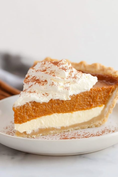 Indulge in the delicious flavors of fall with a homemade pumpkin pie with cream cheese. This rich and creamy dessert is the perfect blend of sweet and savory, making it a crowd-pleaser for any autumn gathering. Whether you're celebrating Thanksgiving or simply craving a taste of the season, this recipe is sure to satisfy your cravings. Treat yourself to a slice of warm pumpkin pie topped with a dollop of whipped cream - it's comfort food at its finest! Pumpkin Pie Recipes Dessert, Biscoff Pumpkin Pie, Pumpkin Cream Cheese Pie Recipe, Pumpkin Pies Recipes, Pumpkin Pie Mix Recipes, Pumpkin Pie With Cream Cheese, Pumpkin Pie With Cream, Pumpkin Pie Cream Cheese, Pumpkin Cream Pie Recipe