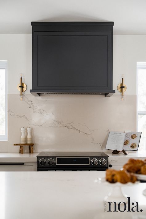 Custom hood with gold sconces Designed by: Studio Nola. Photographed by: Dan Aponte Kitchen Sconces, Full House Renovation, Gold Sconces, Hood Fan, Black Curves, Modern Farmhouse Design, Vent Hood, Kitchen Inspiration Design, House Renovation