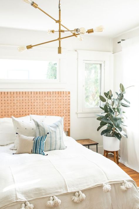 a muted orange woven leather headboard is a stylish accent for this boho bedroom that adds a warm feel to it Bedroom Diy Headboard, Leather Headboard Bedroom, Headboard Crafts, Casual Bedroom, Natural Bedroom, Leather Headboard, Diy Headboard, King Headboard, Bedroom Headboard