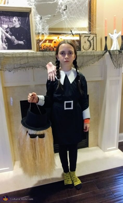 My daughter, Nevaeh, age 9 is wearing Wednesday Addams with thing on her shoulder and cousin it candy bucket. Thing Addams Family Diy, Cousin It Halloween Bucket, Adams Family Thing Hand Diy, Kids Wednesday Addams Costume, Wednesday Addams Craft Ideas, Wensday Adams Halloween Costumes, Wednesday Addams Diy Costume, Wednesday Addams Costume Ideas, Wednesday Addams Crafts