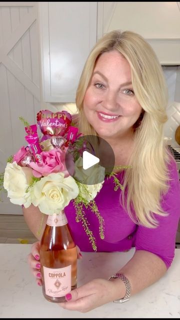 Amy Locurto - Disney Fan & Lifestyle Blog on Instagram: "DIY Wine Bottle Flower Bouquet is a beautiful floral arrangement craft to make with champagne or your favorite wine bottle! 💜—> Comment “WineFlowers” and I’ll send you the details and directions. This easy to make floral arrangement and candy bouquet would make a great centerpiece and perfect for Valentine’s Day, Mother’s Day, or a birthday present! #valentinesday #livinglocurto #flowerarrangement #valentinesdaygift  #mothersdaygift #flowercenterpiece #winebouquet #champagnebouquet #winegift #diygiftideas #diygifts #winelover #flowerbouquet #easyflowerarrangement #birthdaygiftsforher #candybouquet" Wine Mothers Day Gifts, Wine Bottle And Flowers Bouquet, Mother’s Day Vase Ideas, Wine Bottle Flower Bouquet Diy, Flowers On A Wine Bottle, Flower Bouquet With Wine Bottle, Wine Bottle Flower Arrangements Gift, Wine Bottle Floral Bouquet, Champagne Bottle Flowers Bouquet