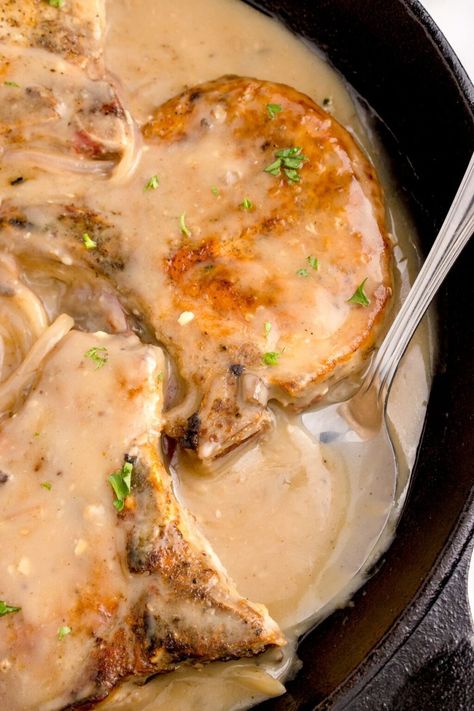 Dive into the comfort of classic home cooking with this juicy smothered pork chops recipe! Perfectly seasoned, tender, and bathed in a rich onion gravy, these pork chops are a savory escape to grandma’s kitchen. Serve them up on a bed of fluffy mashed potatoes or alongside your favorite greens for a hearty meal that’s sure to satisfy. Perfect for family dinners or a cozy date night in. Easy Smothered Pork Chops, Brown Gravy Packet, Gravy For Mashed Potatoes, Best Pork Chop Recipe, Smothered Pork Chops Recipe, Cozy Date Night, Pan Fried Pork Chops, Pork Chops And Rice, Potato Gravy