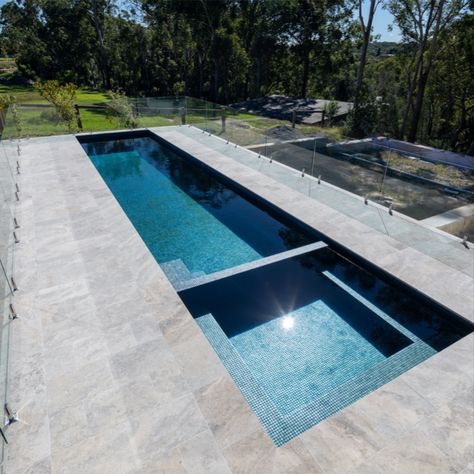 This spectacular semi-above ground lap pool with integrated spa is oh so inviting with those deep blue hues.

A fully-tiled masterpiece, matching the architecturally stunning home, this one has us ready to dive right in.

📲02 9875 4555
📩sales@crystalpools.com.au 
Crystal Pools, Australia’s longest operating pool company 💎

#spapool #spaspillover #lappool #tiledpool #tiledspa #semiabovegroundpool #integratedspa Lap Pool With Spa, Pool With Integrated Spa, Small Modern Pool, Pools Australia, Lap Pools Backyard, Round Spa, Swimming Pool Design Ideas, Lap Pool Designs, Cocktail Pool