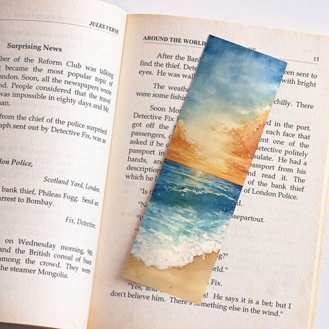 Bask in the beauty of a golden sunrise reflecting off the calm blue waves with this stunning watercolor bookmark. Perfect for ocean lovers and those who cherish a peaceful morning by the sea, this bookmark captures the serene beauty of a sun-kissed horizon. The warm hues of the sky blend seamlessly with the cool tones of the ocean, creating a harmonious and calming image. Ideal as a gift for beach lovers or a special treat for yourself. Details: Original watercolor artwork High-quality print on durable material Ideal for art lovers and bookworms Handmade with meticulous attention to detail Handmade Stationary Each item features a high-quality print of the original watercolor artwork. SIZE 2 X 6 Inches --------------------------------------------------------- IMPORTANT Shipping Details: We Watercolor Art Ocean, Watercolor Samples, Seascape Watercolor, Horizon Art, Handmade Stationary, Calming Images, Peaceful Morning, Golden Sunrise, Handmade Bookmarks Diy