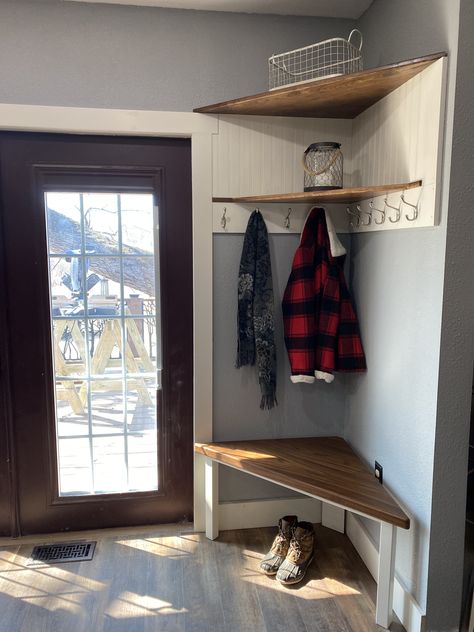 My brother built this custom corner shoe/coat storage center with solid walnut shelves, a bead board back and plenty of hooks.  It effectively utilized an awkward corner that was too small for anything useful. Small Entrance With Storage, Corner Shoe Storage Entryway, Corner Shoe And Coat Storage, Corner Storage Hallway, Kitchen Coat Storage, Corner Shoe Storage Ideas, Small Hall Coat Storage, Shoe And Coat Storage Small Space, Coat Hanging Ideas For Small Spaces