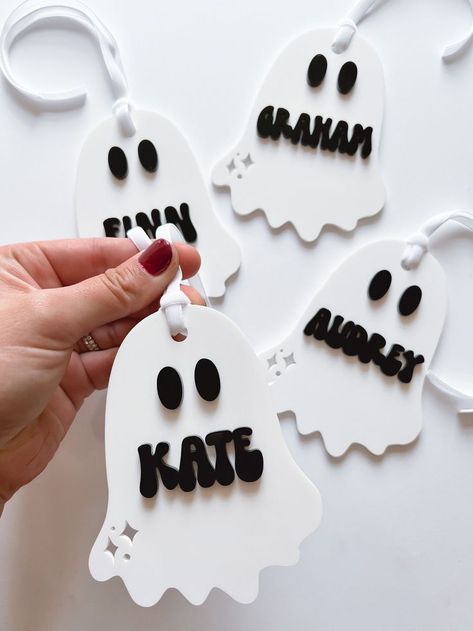 Introducing our spooktacular Halloween ghost tags, now with a personalized twist! 👻🎃 Whether you're hosting a haunted house party or looking to add a ghoulishly charming touch to your Halloween treats, our ghost tags are here to make your celebration extra special. Each tag is carefully customized with a name of your choice, adding a hauntingly personal touch to your Halloween decorations and gifts. Your guests will be enchanted by these eerie yet adorable apparitions that not only celebrate the spirit of the season but also showcase your att Ghost Party Favors, Halloween Glowforge, Ghost Theme Party, Trick Or Treat Bucket, Kids Halloween Gifts, Boo Baskets, Glowforge Projects, Halloween Gift Baskets, Halloween Personalized