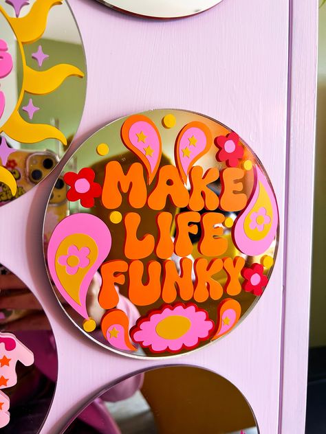 Retro paisley make life funky mini mirror. Each mini disc mirror features a colourful & fun design with a positive message to make you feel FAB or we can all relate too! They look great on your dressing table, wall, or even the perfect gift. One size - 15cm Acrylic mirror No hanging on the back Recommend hanging using a small command strip or white tack. Funky Wall Hangings, Painted Wall Mirror, Groovy Mirror Diy, Funky Decor Ideas, Ideas For Room Walls, Cool Mirror Designs, Funky Decor Aesthetic, Funky Craft Room, Quirky Wall Decor