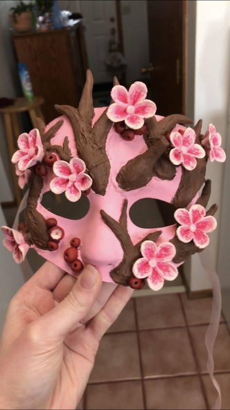 This was made for my high school’s art showcase night. It was paired with an entirely functional, painted outfit. Made using a plastic mask base, air dry clay, hot glue, ribbon, and of course paint. Entire mask making process (excluding drying time) was 17.5 hours over three days. Plastic Mask, Art Showcase, School S, Blossom Tree, High School Art, S Art, Cherry Blossom Tree, Blossom Trees, Dry Clay