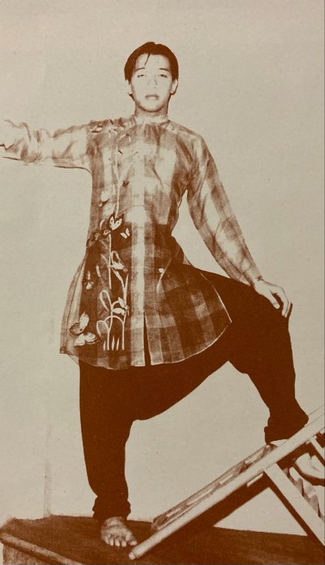 A long, plaid Ernest Santiago Barong Tagalog with garden embroidery, collarless, full button down design,  paired with drop crotch pants circa late 1970’s 1920s Filipino Fashion, Streetwear Philippines, Filipino Fashion Street Styles, Filipino Streetwear, Filipino Barong, Filipino Traditional Clothing, Philippine Traditions, Philippines Outfit, Philippine Fashion