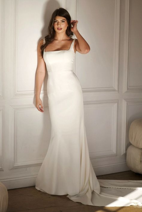 This sleek column wedding gown is for the fashion-forward bride. The classic square neckline and shoulder straps frame an expertly fitted bodice of understated elegance. The column skirt flows from the bodice, skimming the figure with tailored precision as a low scooped back adds a sexy touch. A row of fabric-covered buttons grace the full length of the gown, adding a handcrafted couture finish for an unforgettable walk down the aisle. Column Wedding Gown, Martina Liana Wedding Dress, Sweetheart Bridal, Modern Bridal Gowns, Column Wedding Dress, Kleinfeld Bridal, Essense Of Australia, Blush Bridesmaid Dresses, Martina Liana