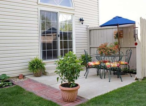 Keep things simple with a smaller patio furniture set. Perfect for everything from morning coffee relaxation or catching up with an old friend over a drink! | 10 Ways to Dress Up a Drab Concrete Patio Yard Drainage, Cement Patio, Concrete Patio Designs, Patio Cover, Outdoor Eating, Front Patio, Beautiful Patios, Sliding Patio Doors, Brick Patios