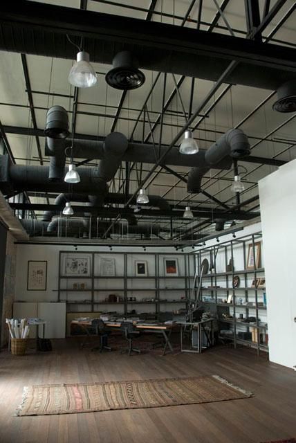 Interior view of director's office looking southeast | Archnet Exposed Ceiling Design, Exposed Ductwork, Warehouse Interior, Interior Palette, Hvac Duct, Commercial And Office Architecture, Industrial Style Furniture, Bistro Tables, British India