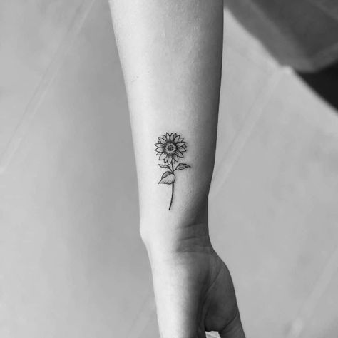 Simple Small Flower Tattoos Sunflowers, Small Sunflower Wrist Tattoo, Small Black Sunflower Tattoo, Tattoo Sunflower Arm, Small Sun Flower Tattoo, Tattoo Of Sunflowers, Wrist Sunflower Tattoos For Women, Flower Tattoo Side Of Wrist, Back Wrist Tattoo