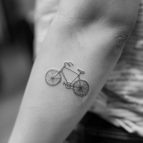 Discover the elegance of simplicity with this intricate, minimalist bicycle tattoo symbolizing freedom, adventure, and the joy of life's journey. Save this inspiration and follow for more unique designs. In this close-up, every fine line and curve breathes a vintage charm into the wearer's forearm, transforming skin into a canvas of personal expression. Let this be the ride into your next artistic venture. #MinimalistTattoo #BicycleDesign #VintageCharm #InkInspiration #BodyArt # Fine Line Bicycle Tattoo, Tattoo Bicycle, Jewlery Tattoo, Bike Tattoo, Rain Tattoo, Dutch Bicycle, Bicycle Tattoo, Tattoo On Forearm, Bike Tattoos