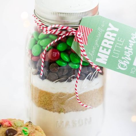 Layered cookie mix in a jar recipe that makes the perfect homemade Christmas gifts. These are always a big hit! Free printable tag and instructions included. This post is sponsored by Kroger I’ve shared plenty of mason jar gifts before, but this mason jar cookie mix has to be my sweetest one yet. Now I know the ... Cookie Mix In A Jar Recipe, Cookie Mix Jar, Mnm Cookies, Cookie Mix In A Jar, Cookie Jar Gifts, Mason Jar Cookies Mix, Cookies In A Jar, Mix In A Jar, Mason Jar Cookies