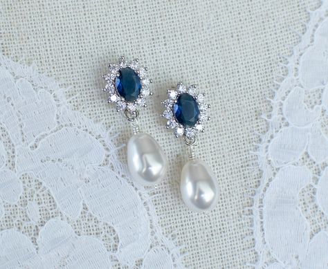 Blue Sapphire Bridal Earrings, Sapphire Bridal Earrings, CZ Blue Sapphire Pearl Stud Earrings, Round CZ Swarovski Pearls Stud Earrings The earrings are made of: - 8mm Swarovski pearls set in rhodium plated over brass stud earrings - 20x15mm white and blue sapphire cubic zirconia oval drops. Back to my shop http://www.etsy.com/shop/crinadesign73 Thank you for visiting my store! Sapphire Bridal Jewelry, Something Blue Earrings Wedding, Pearl Sapphire Earrings, Sapphire Wedding Earrings, Sapphire Pearl Earrings, Pearl And Sapphire Earrings, Blue Earrings For Wedding, Something Blue Earrings, Sapphire Earrings Wedding