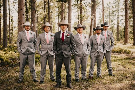 Gray, blush, and burgundy groomsmen with cowboy hats Cowboy Wedding Tuxedo, Cowboy Hat And Suit Wedding, Western Groomsmen Attire Grey, Burgundy And Blush Mens Wedding Attire, Burgundy Cowboy Wedding, Grey Suit With Cowboy Boots, Suits And Cowboy Hats Wedding, Wedding Suit With Cowboy Hat, Groomsmen With Cowboy Hats