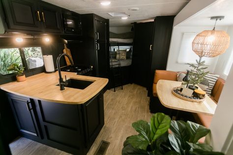 Black Cabinets In Camper, Dark Caravan Interior, Dark Camper Interior, Dark Rv Interior, Black Camper Interior, Boho Trailer, Green Interior Paint, Rv Decorating, Camper Redo