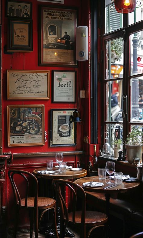 Cozy Paris bistro with red walls, vintage posters, and wooden tables. Classic French café atmosphere. Red Coffee Shop, Buvette Paris, Classic Coffee Shop, Parisian Dining, Paris Bars, Best Restaurants In Paris, Paris Bistro, Parisian Bistro, Cozy Restaurant