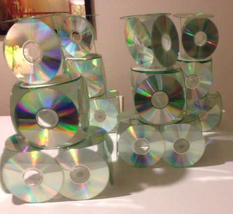 CD tower centerpieces, made with CDs and a lot of hot glue Cd Centerpiece Ideas, 2000s Centerpiece Ideas, 1990 Party, Vans Party, 2000s Party Theme, Cd Tower, 90s Themed Party, Valentine Banquet, 90s Party Decorations