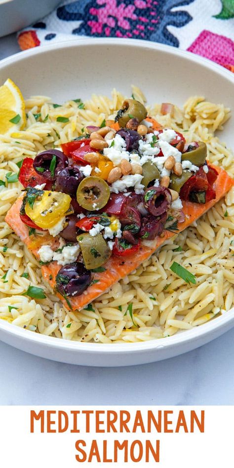 Mediterranean Salmon -- This Mediterranean Salmon is a flavorful, easy weeknight dinner that brings together the best of Greek ingredients. Oven-baked salmon is topped with olives, tomatoes, red onion, fresh herbs, feta, and more and is served over lemon orzo for a bright and simple meal. via @wearenotmartha Salmon And Orzo Dinners, Mediterranean Salmon Dinner, Salmon Orzo Recipe, Greek Salmon, Grilled Vegetable Salads, Mediterranean Salmon, Salmon Chowder, Delicious Salmon Recipes, Hummus And Pita