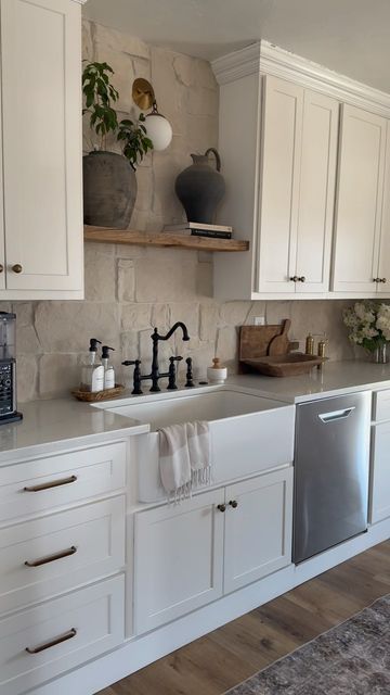 113K views · 8.8K likes | Kristina Evans on Instagram: "Answering my most asked questions about my kitchen—  Pendant lights: @shadesoflight Saresh Drum Pendants  Dining table: we built it, it’s solid concrete for the top! Backsplash stone: Alamo sandstone random ledger panel from @flooranddecor  Pots: vintage vessels I find on Etsy or from @agedinteriors.studio  Floral stems: @afloral  Need something else? Comment “kitchen” and I’ll send ya my LTK post of this room where I’ve linked everything I can!  . . #kitchendesign #organicmodern #modernhome #europeanfarmhouse #stonebacksplash #homeinspo" Stone Backsplash With White Cabinets, Stone Backsplash White Cabinets, Solid Stone Backsplash, Alamo Sandstone Backsplash, Sandstone Backsplash Kitchen, Alamo Sandstone Random Panel Ledger, Backsplash Panels Kitchen, White Cabinets Stone Backsplash, Rough Stone Backsplash Kitchen