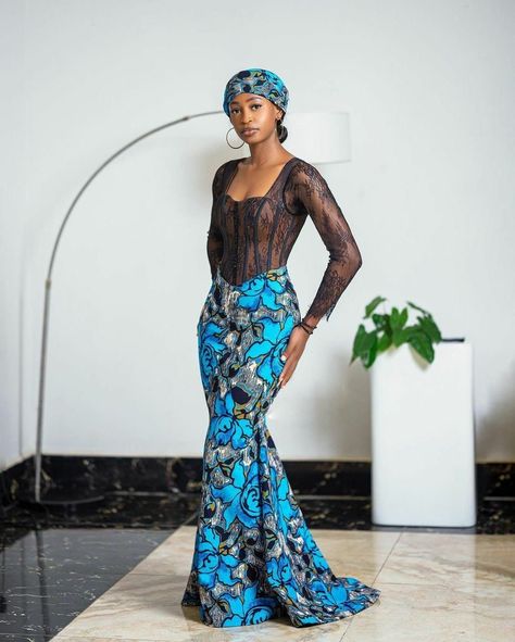 Enhance your style with this exquisite African Print And Lace Corset Mermaid Dress.  Embrace elegance and culture in this stunning piece - perfect for any formal event. Step into sophistication with this unique Black Pencil Dress and make a statement that's bound to turn heads.  Experience the beauty of a Long Ankara Dress with a modern twist - shop now and stand out from the crowd! Chilanga Mulilo Dresses For Guests, Wedding Fishtail Lace Dress, Fitted Fishtail Maxi Dress For Wedding, Fitted Lace Blue Gown, Fitted Blue Lace Gown, Blue Fitted Lace Gown, Ankara Corset Dress, Chilanga Mulilo, Long Ankara Dresses