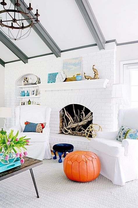 Living room with fireplace filled with decorative wood Ceiling Beams Living Room, Painted Beams, Beams Living Room, White Brick Fireplace, Grey Ceiling, Old Fireplace, Wood Beam Ceiling, Living Room Ceiling, White Brick