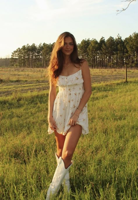 Basic Photography Poses, Sundress Senior Pictures, Meadow Instagram Pictures, Senior Pic Dress Ideas, Short White Dress With Cowboy Boots, Senior Photo Dress Ideas, Short Dress Senior Pictures, Senior Pictures Outfits Cowboy Boots, Spring Inspo Pics