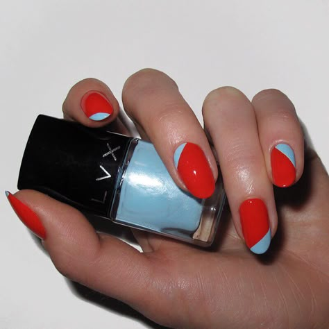 Red Nails: Red + Blue. A glossy red polish next to shiny baby blue for a geometric nail. Click through for 30 red nail ideas. #rednails #nailideas #nailart IG: @nataliepnails Fourth Of July Nail Ideas, 4th Of July Nail Ideas, Red Nail Ideas, Red Nail Design, Two Tone Nails, 4th Of July Nail, Trendy Nail Polish, Red Nail Art Designs, Fourth Of July Nails